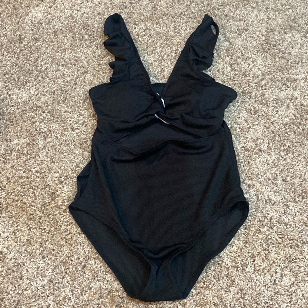 Girls one piece black suit with sarong, removable liners inside top. 13/14